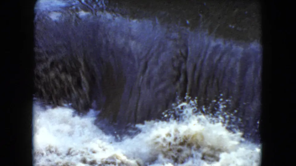 1951 Cleveland-area 8mm view of cascading river water turning into white foam below a low spillover.