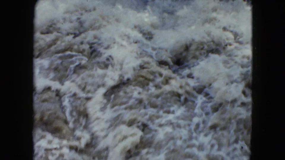 1951 8mm Cleveland, Ohio frame focused on swirling rapids and pale foam near the end of the clip.