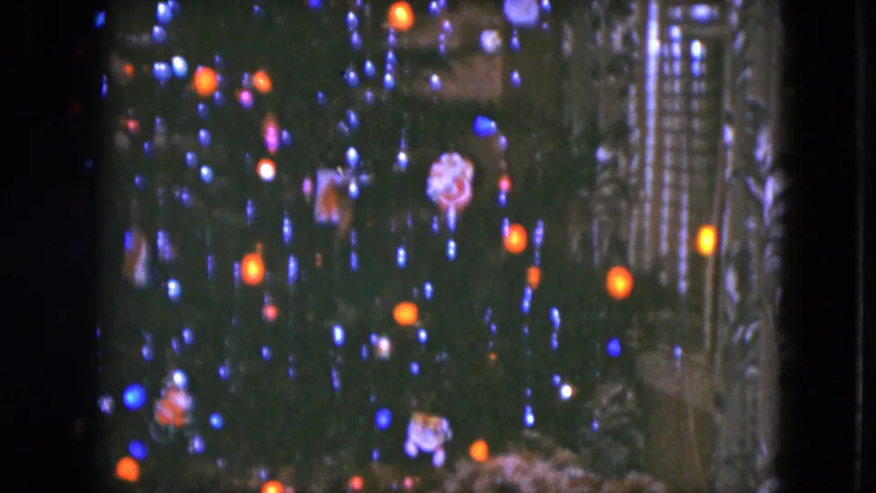 1951 Cleveland frame showing the lower Christmas tree, glowing lights, ornaments, and part of a miniature train-set village.