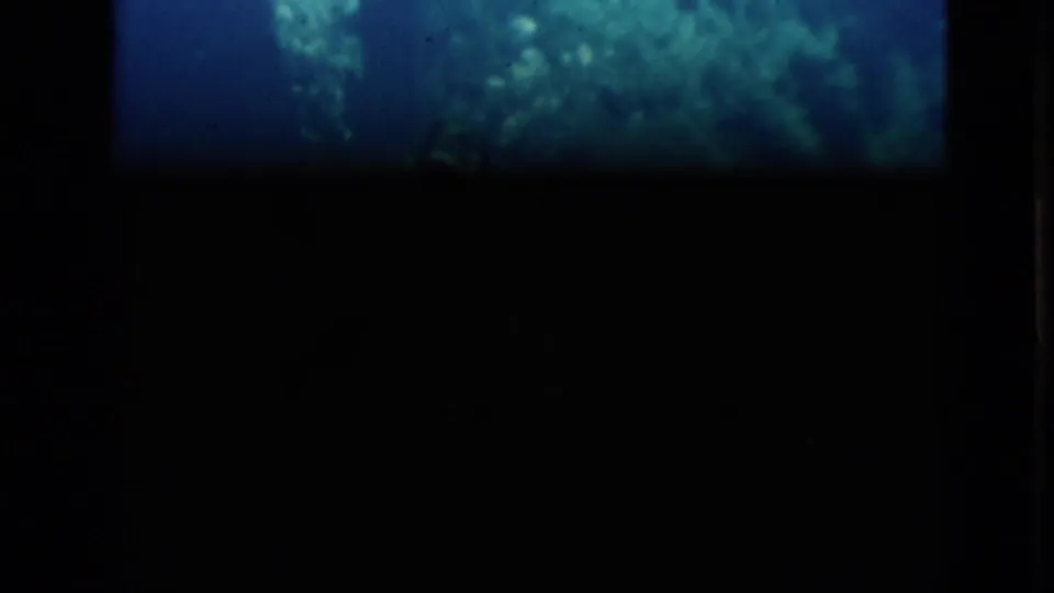 Final 1952 Florida 8mm contact-sheet frame appears mostly dark, with only faint underwater color and film border detail visible.