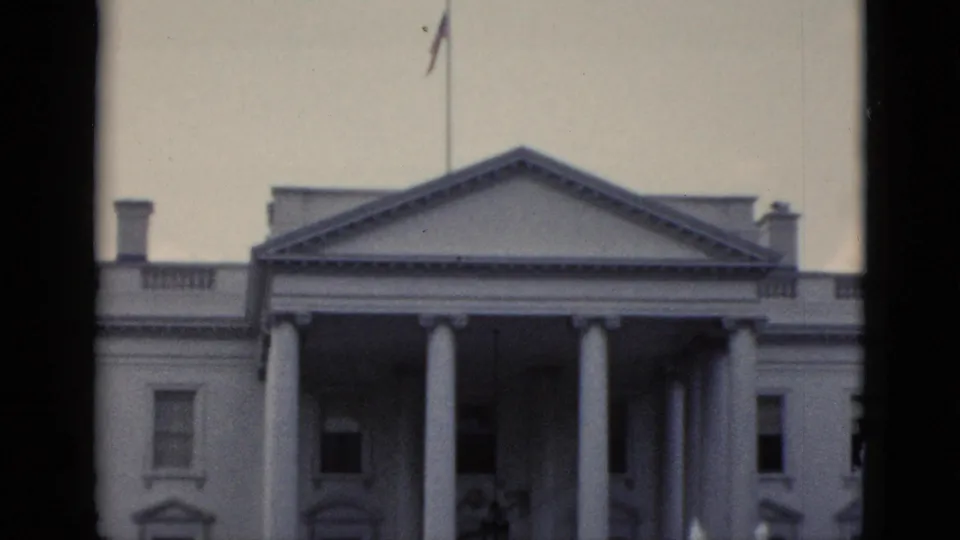 White House North Portico, Washington DC, circa early 1950s — American flag flies from the masthead above the neoclassical facade.