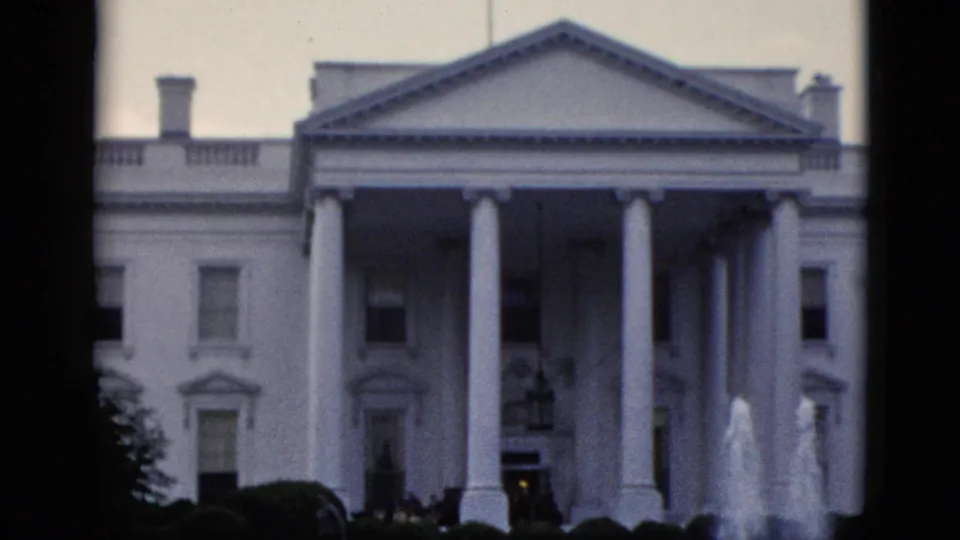 White House North Portico with North Lawn fountain spraying in the foreground, filmed on 8mm circa early 1950s, Washington DC.