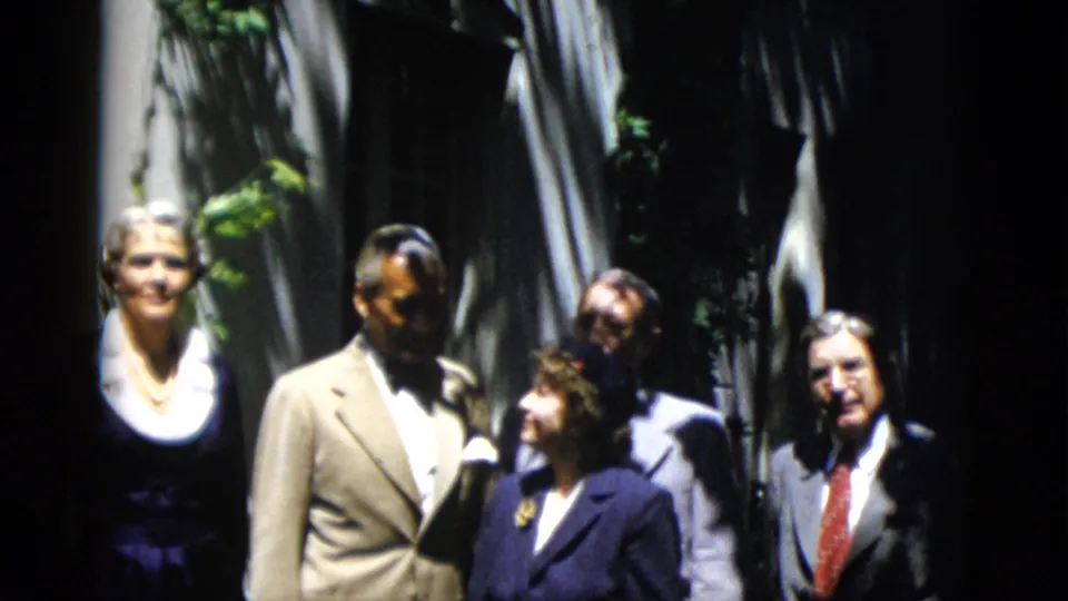 By the final frame, more of the formal group is visible in the 1952 Washington, DC outdoor home-movie scene.
