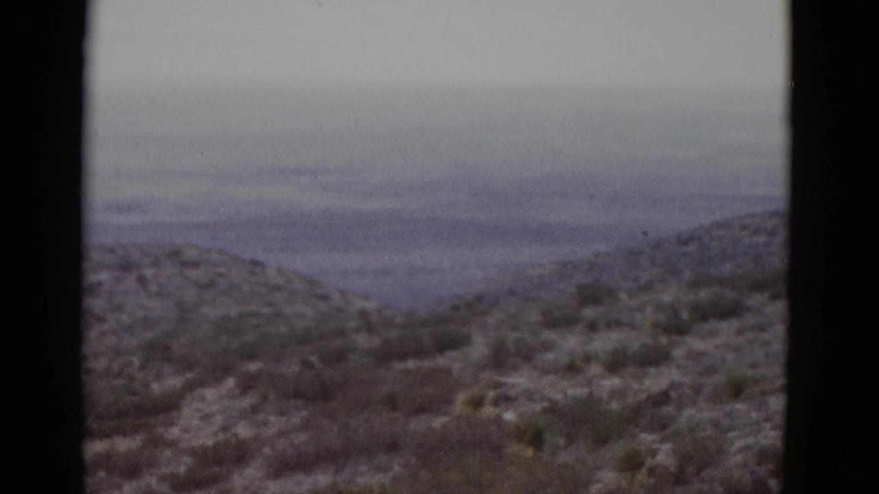 Arid desert hill covered in sparse low scrub, photographed on 8mm color film consistent with a Utah landscape circa 1952.