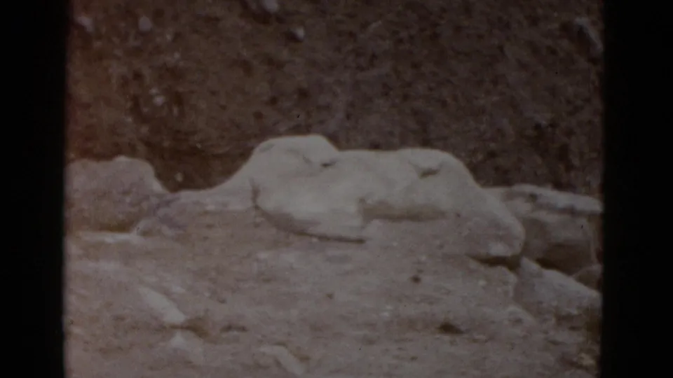 Close-up of pale sedimentary rock formations on arid Utah desert floor, 8mm home movie footage from 1952.
