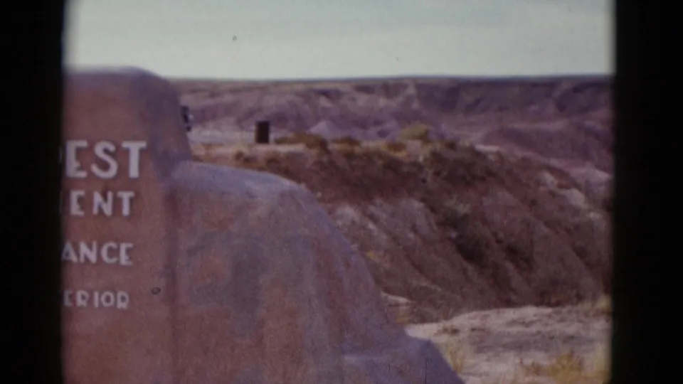 1952 Arizona 8mm view with the entrance marker partly cropped as the camera favors the surrounding canyon terrain.