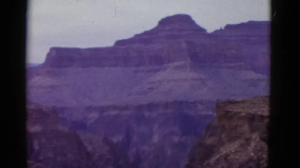 Arizona canyon landscape from 1952 metadata, showing distant rock layers and a nearer rocky shelf at the lower right.
