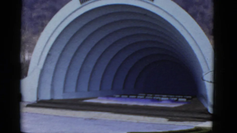 1952 California 8mm view of an empty outdoor amphitheater with a white concentric arched shell.