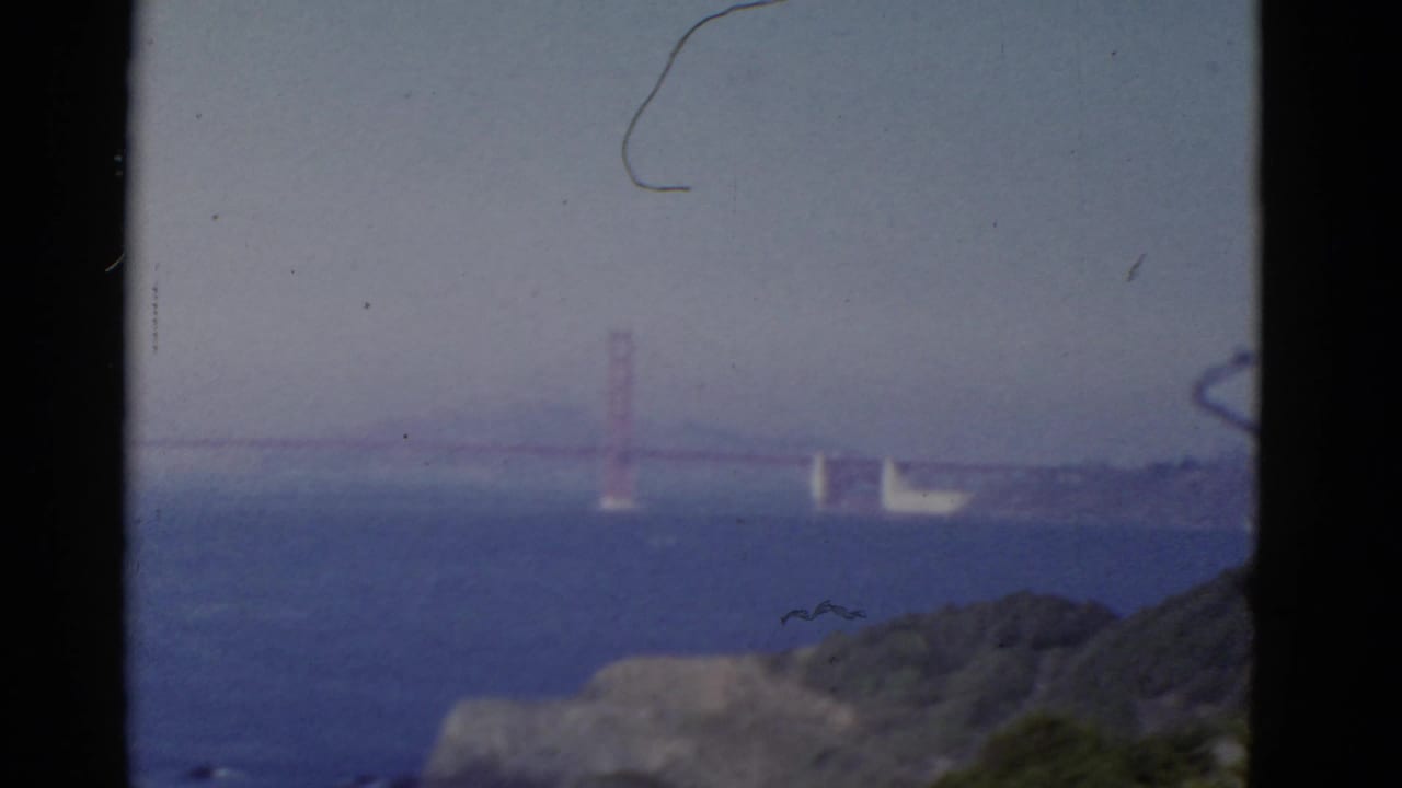 Soft distant view of the Golden Gate Bridge over the bay with shoreline haze.