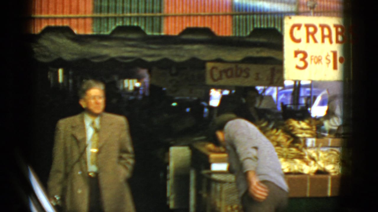 1952 San Francisco market scene with a suited man near a crab counter and a prominent hand-painted Crabs 3 for $1 sign.