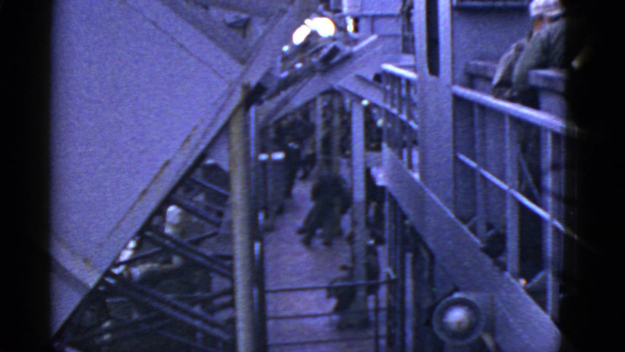 1950s 8mm naval deck view near San Francisco with sailors in white caps beside railings and ship stairways.