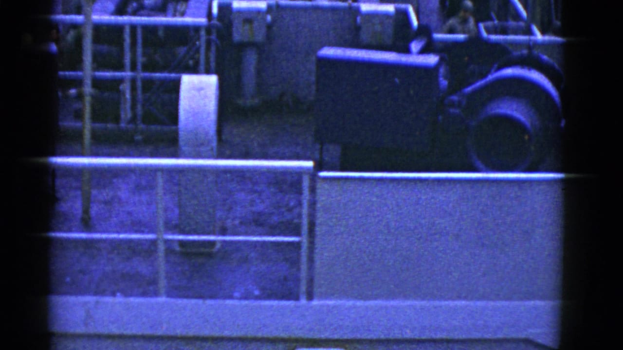 Upper ship deck with railings, equipment, and part of the Marine Adder sign below.