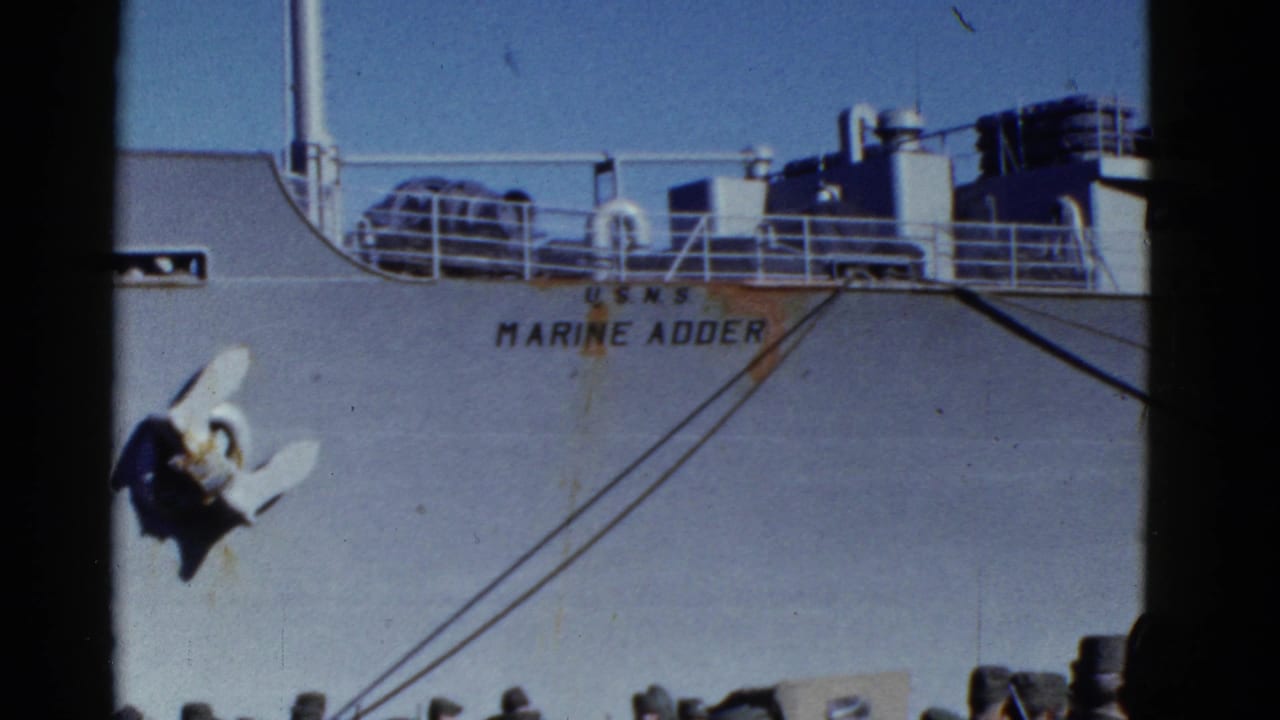 1952 San Francisco 8mm frame showing the U.S.N.S. Marine Adder name on a ship hull in bright daylight.