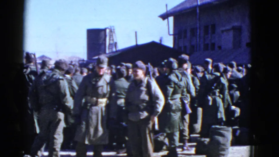 In supported San Francisco footage, U.S. soldiers in olive uniforms stand outdoors near buildings and gear.