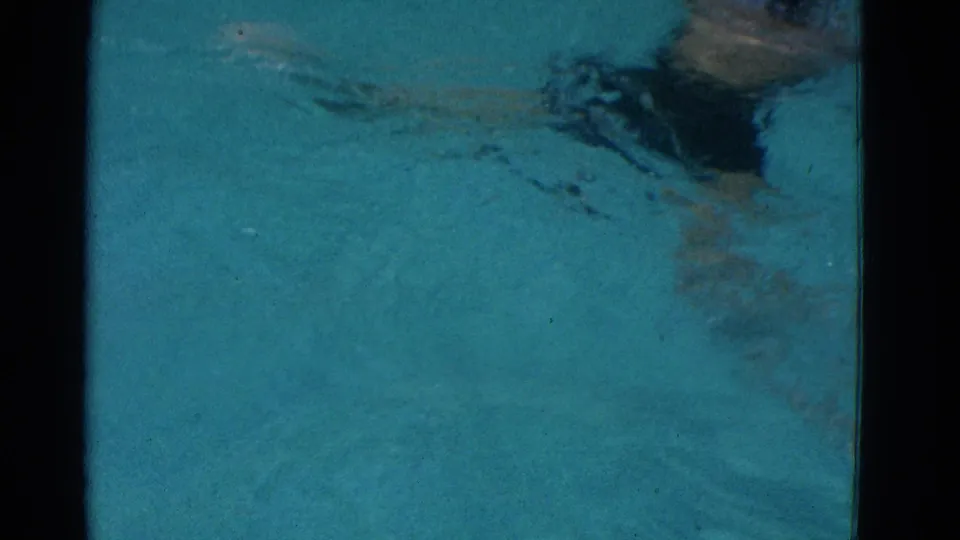 The final frame shows the swimmer moving away through blue water, with dark swimwear and soft 8mm texture visible.