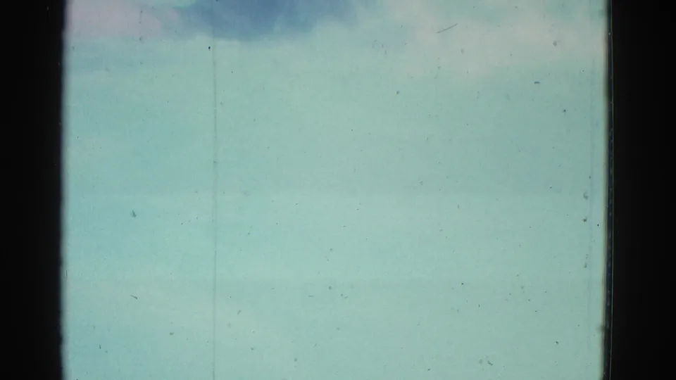 Soft 8mm frame from the Yonkers pool clip, mostly showing pale blue-green water and film wear.