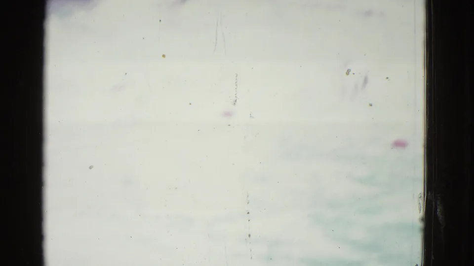 Overexposed 1953 Yonkers pool frame with pale water, faint lane markers, and a swimmer mostly outside the visible area.