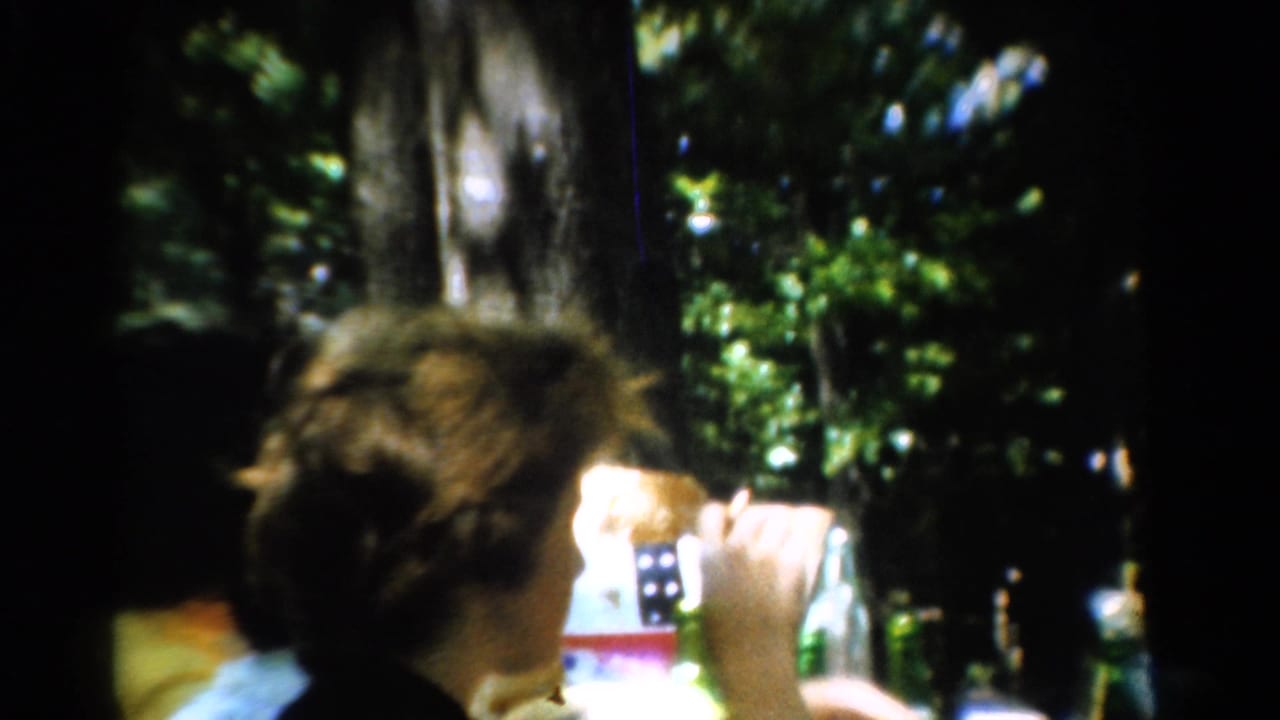 Person turns in profile while holding food or a cup near the mouth.