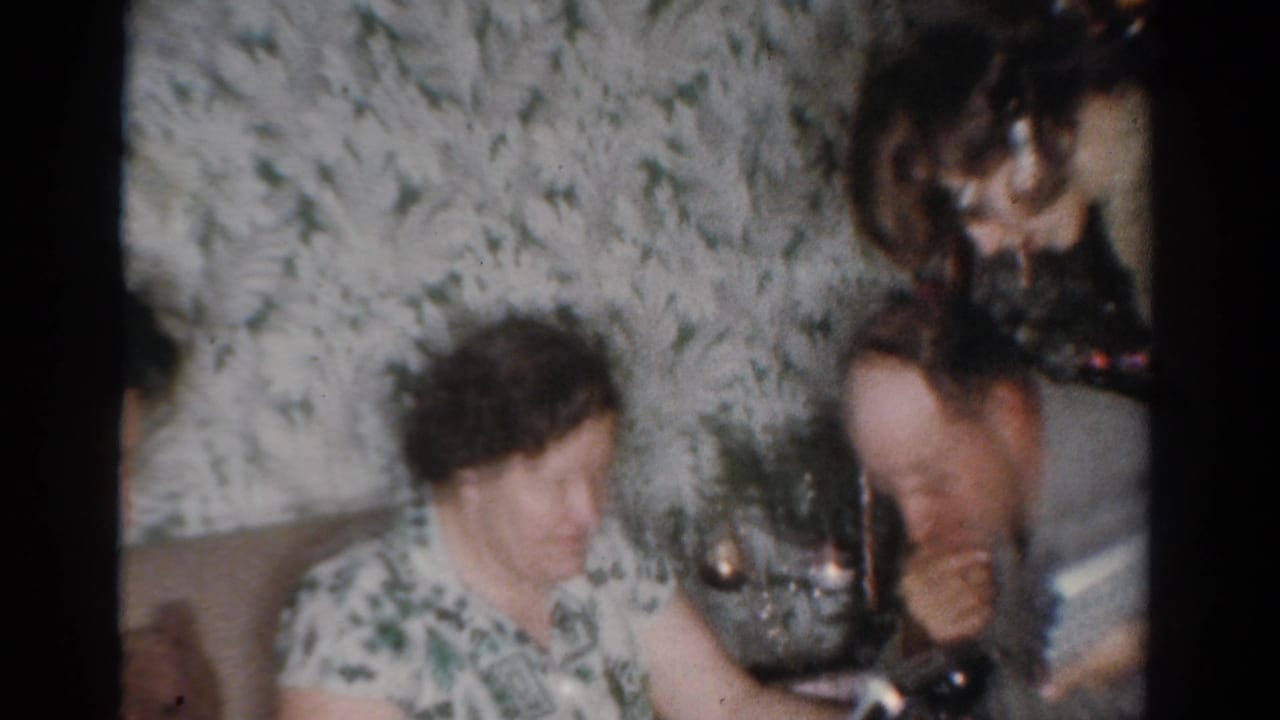 The Toledo holiday scene shows an older woman, a partially visible man, and a younger woman gathered near the Christmas tree.