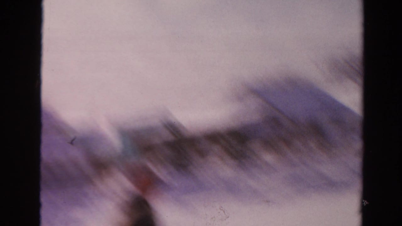 The final frame is heavily blurred by camera or subject motion, showing snowbanks and indistinct winter shapes in the residential scene.