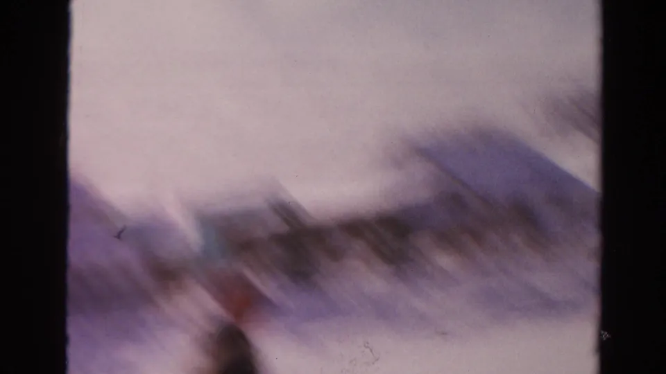 The final frame is heavily blurred by camera or subject motion, showing snowbanks and indistinct winter shapes in the residential scene.