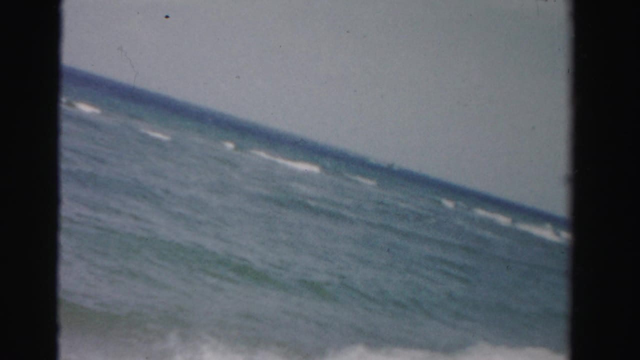 Tilted view of ocean waves with no people visible in the frame.
