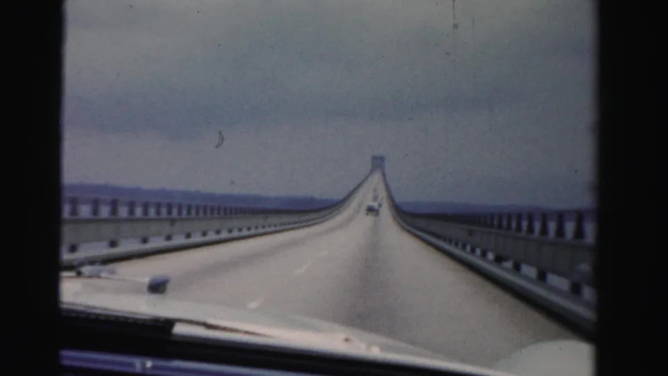 Mid-1950s 8mm view from a car traveling across a Dade County, Florida causeway over water.