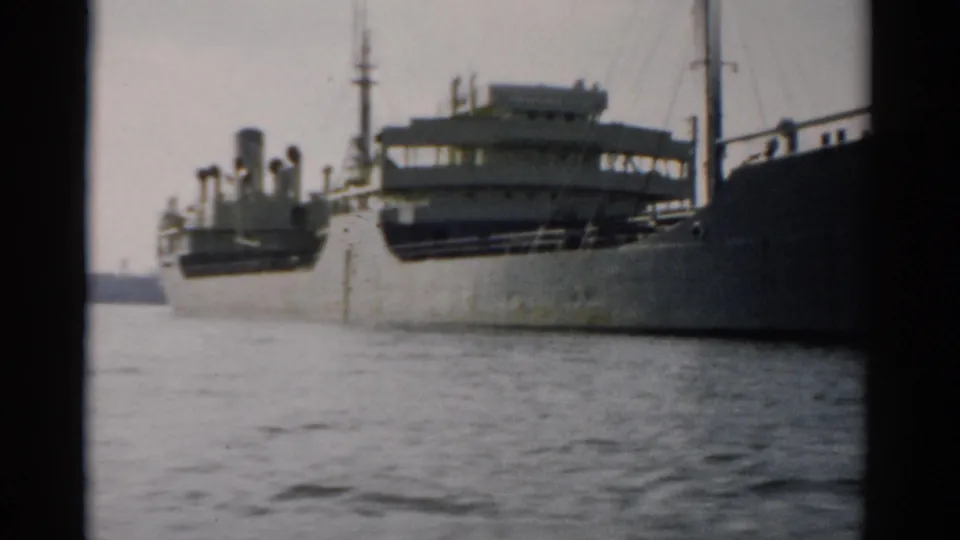 Multi-deck ferry or excursion boat with white superstructure moored at a concrete quay, 8mm home-movie footage circa 1957, possibly near Catskill, New York.