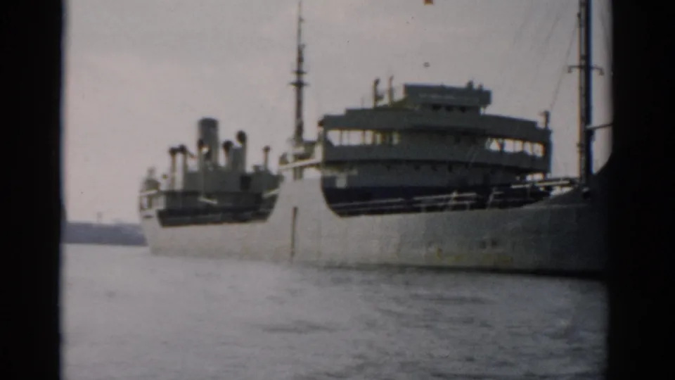 Multi-deck ferry and a smaller accompanying vessel moored at a concrete pier, 8mm home-movie footage circa 1957, possibly near Catskill, New York.