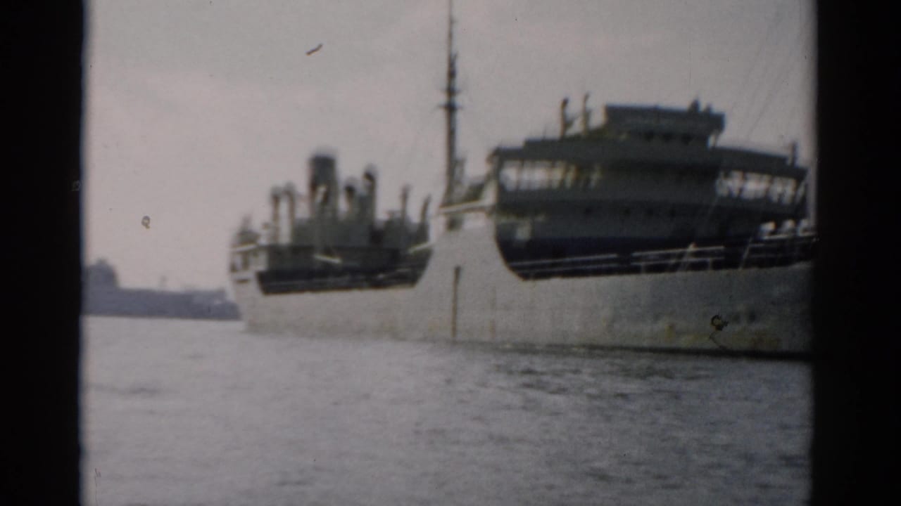 Large cargo ship on calm water near Catskill, New York, circa 1957, showing hull and superstructure in 8mm color footage.