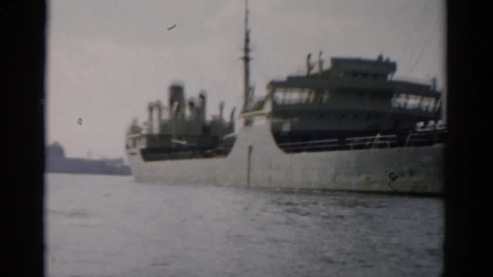 Large cargo ship on calm water near Catskill, New York, circa 1957, showing hull and superstructure in 8mm color footage.