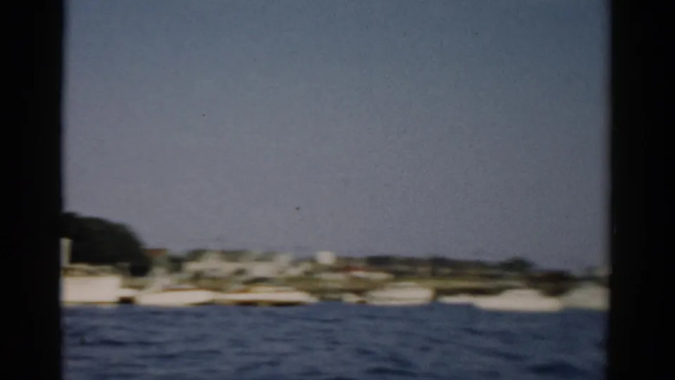 Catskill, New York harbor area, c. 1957 — open water and distant shore filmed through a window frame on 8mm color film.