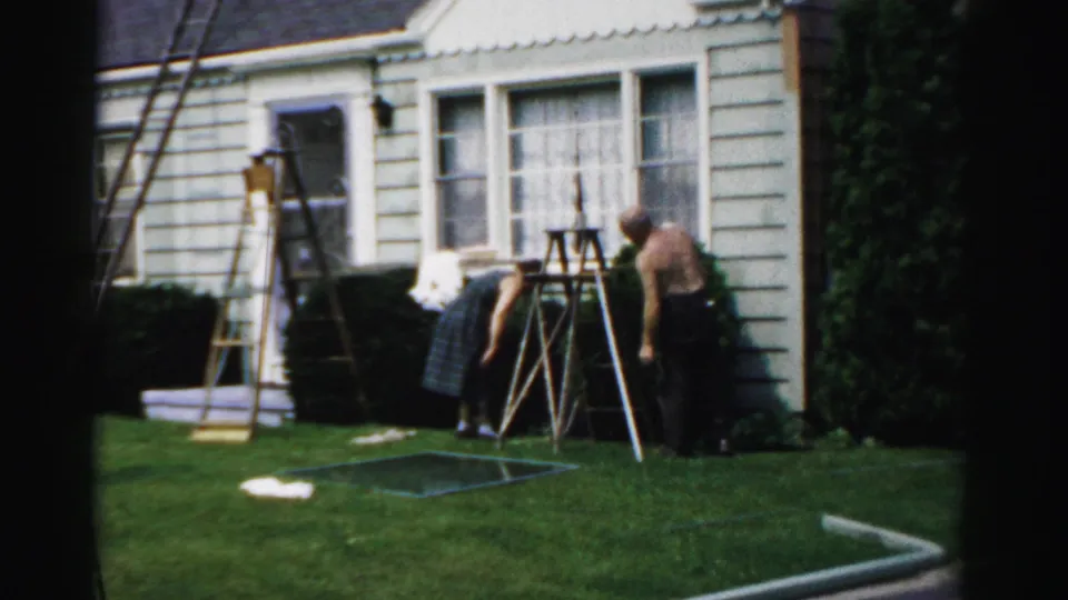 The home-repair sequence continues with two adults beside ladders, bushes, windows, and a green lawn outside a light-sided house.