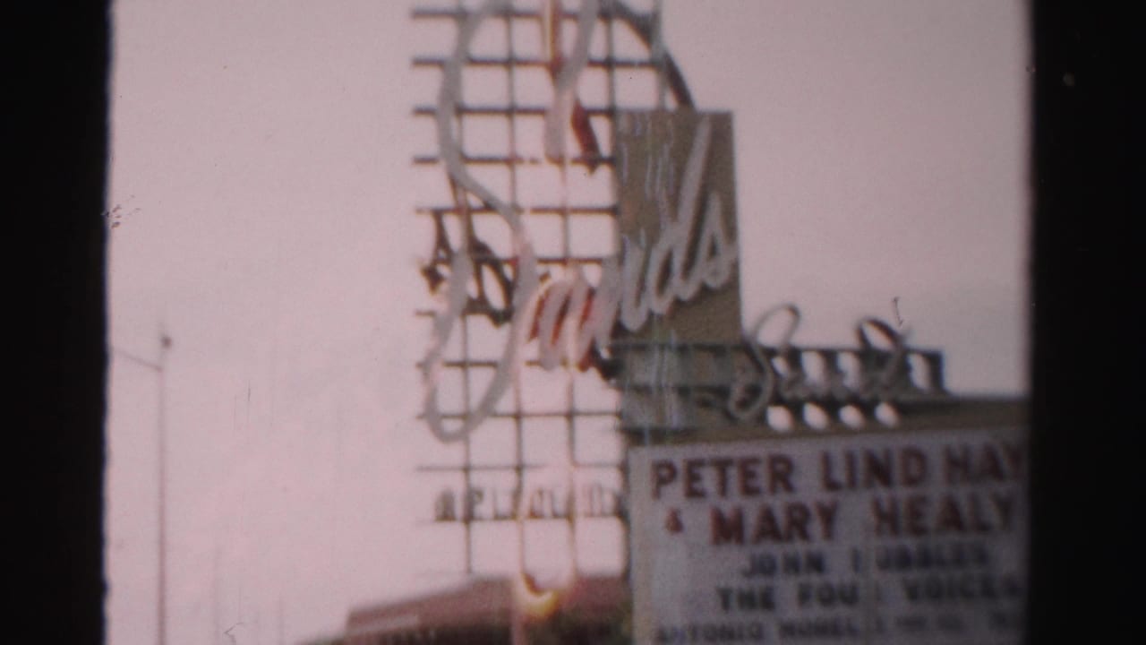 Soft 8mm view of the Sands marquee with performer names partly visible.