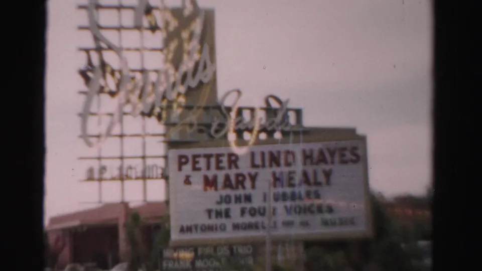 1957 Las Vegas frame of the Sands Hotel marquee listing Peter Lind Hayes, Mary Healy, John T. Bubbles, and The Four Voices.