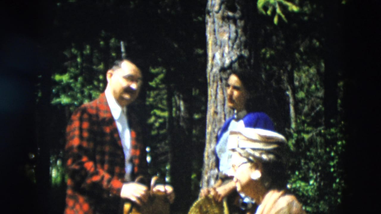 The 1958 Yellowstone scene shows the man facing two women in a sun-dappled pine forest.