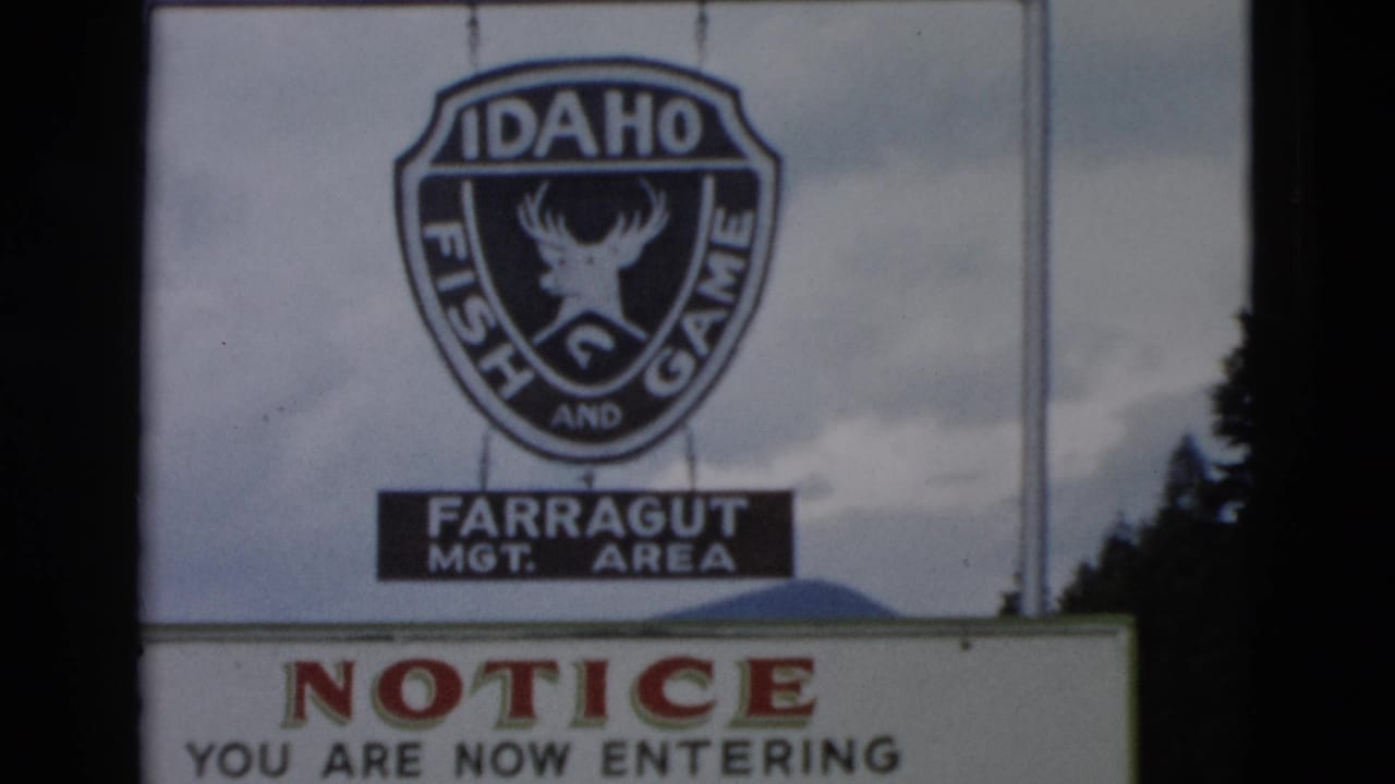 Farragut management area sign above a partial notice board.