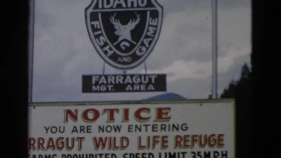1958 8mm frame with the refuge notice text visible beneath the Idaho Fish and Game shield.