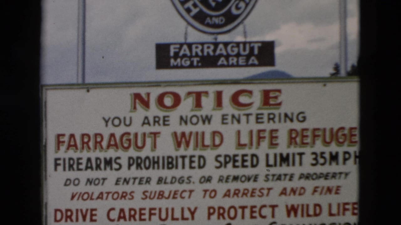Close view of a Farragut Wild Life Refuge entrance notice with Fish and Game signage above.