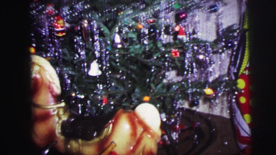 1973 Lynbrook holiday interior showing a decorated Christmas tree with tinsel, lights, and a vintage rocking horse toy.