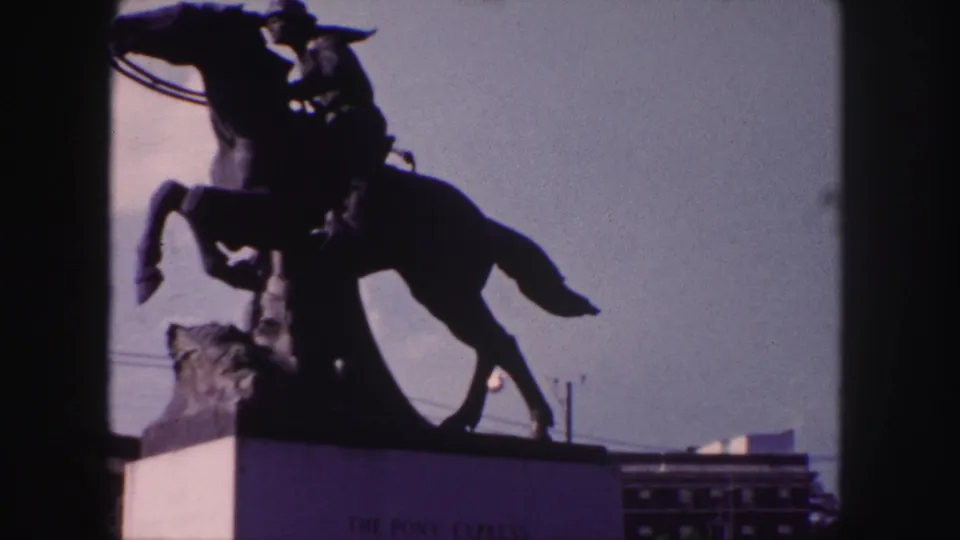 1958 Denver footage shows the Pony Express monument from a low visitor angle, with the horse and rider strongly silhouetted.