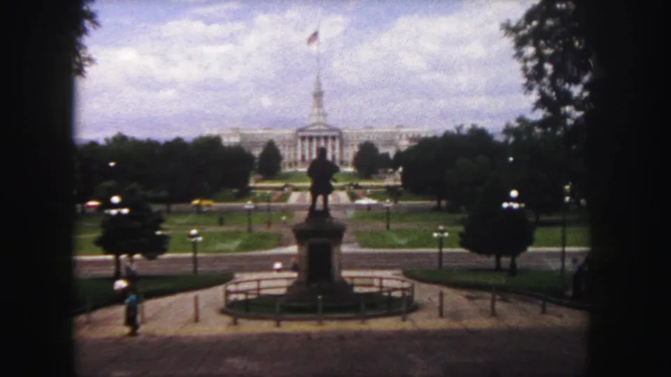 Denver Civic Center Park in 1958, with the Colorado State Capitol behind a central statue and small figures on the walkways.