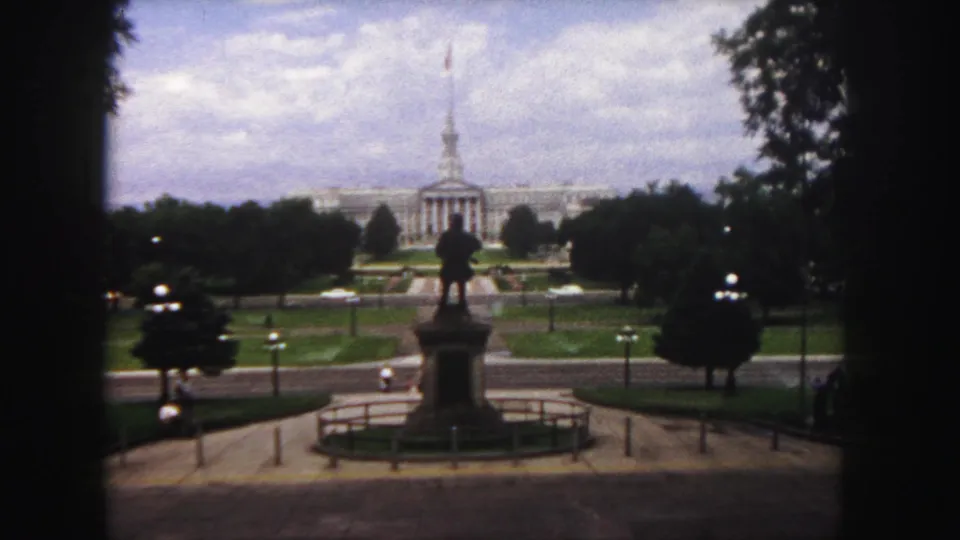 A final 1958 Denver frame centers the Civic Center Park statue with the Colorado State Capitol rising behind trees and lawns.