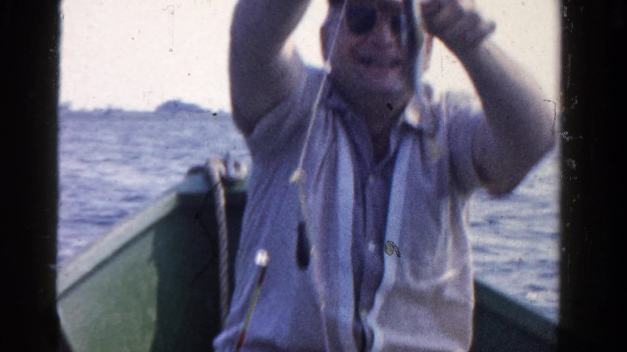 A man in sunglasses and a light shirt handles fishing gear from a small boat on Ontario water, based on the supplied clip metadata.