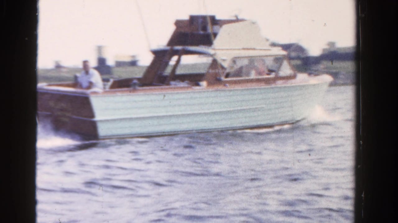 The 1958 Ontario home movie shows the classic motorboat running across the water with wake trailing behind it.