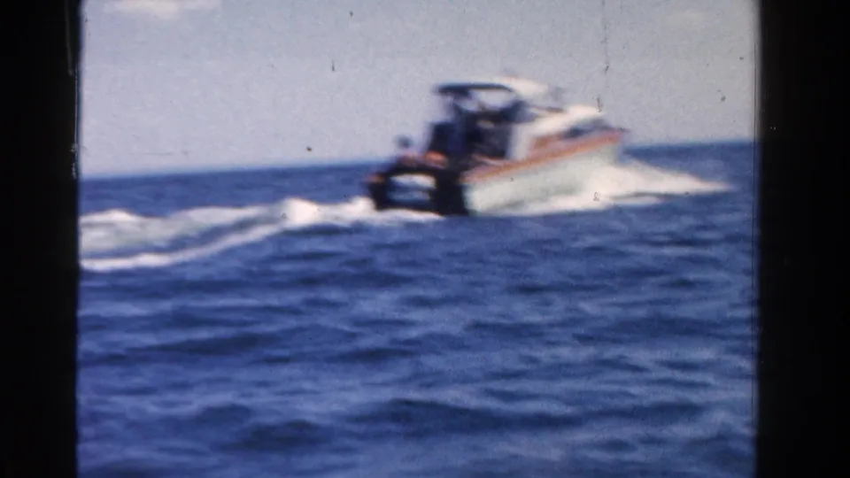 A small motorboat moves away across open blue water in a 1958 Ontario recreational boating scene.