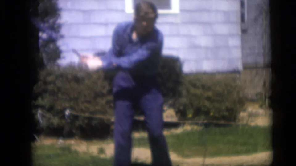 The Camden home-movie clip catches the man in follow-through after swinging a golf club in a suburban yard in 1959.