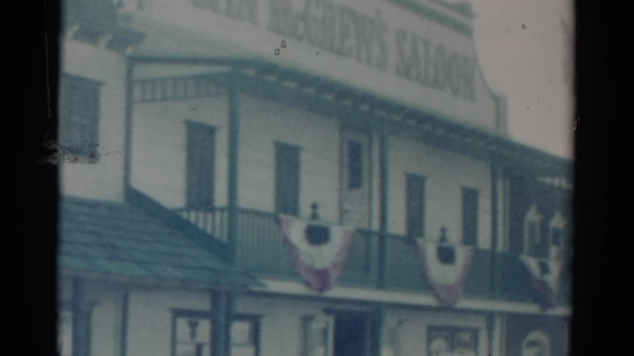 Catskill, New York 1959 frame showing the saloon facade, upper balcony, multiple windows, and patriotic bunting.