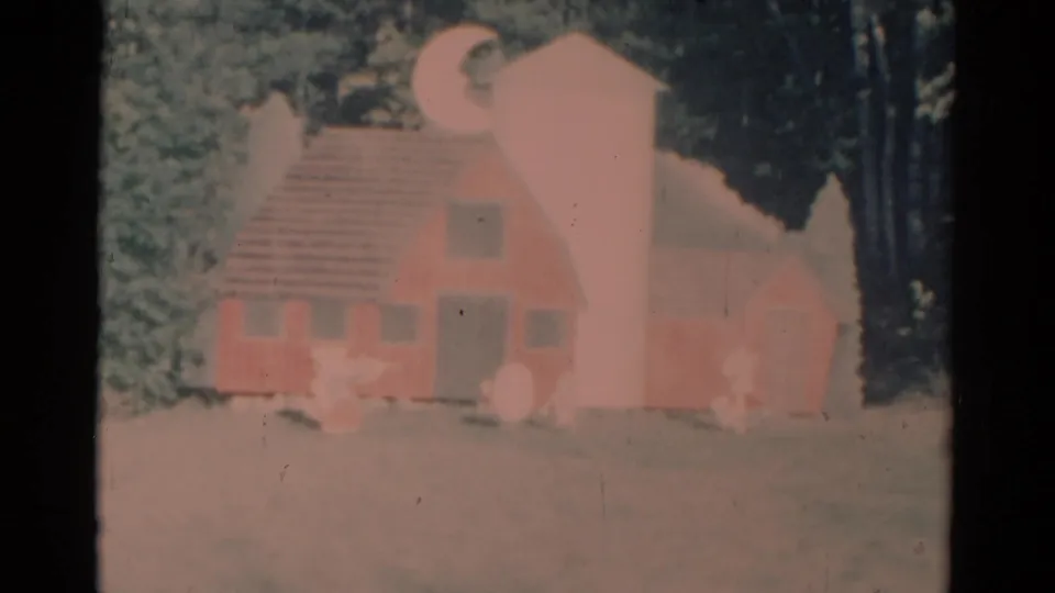 Handcrafted pink barn or house set with a moon and stars, captured in faded 1959 Catskill 8mm footage.