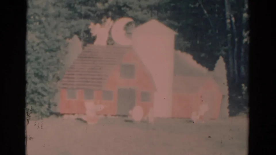 Later frame of the handmade pink barn set, with moon and stars visible in faded Catskill 1959 home-movie footage.